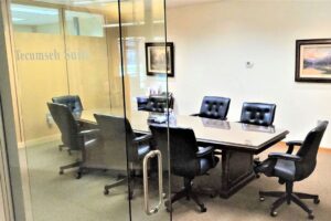 A table surrounded with office chairs