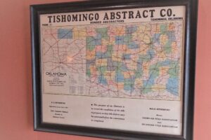 A map of the state of Oklahoma framed on a wall